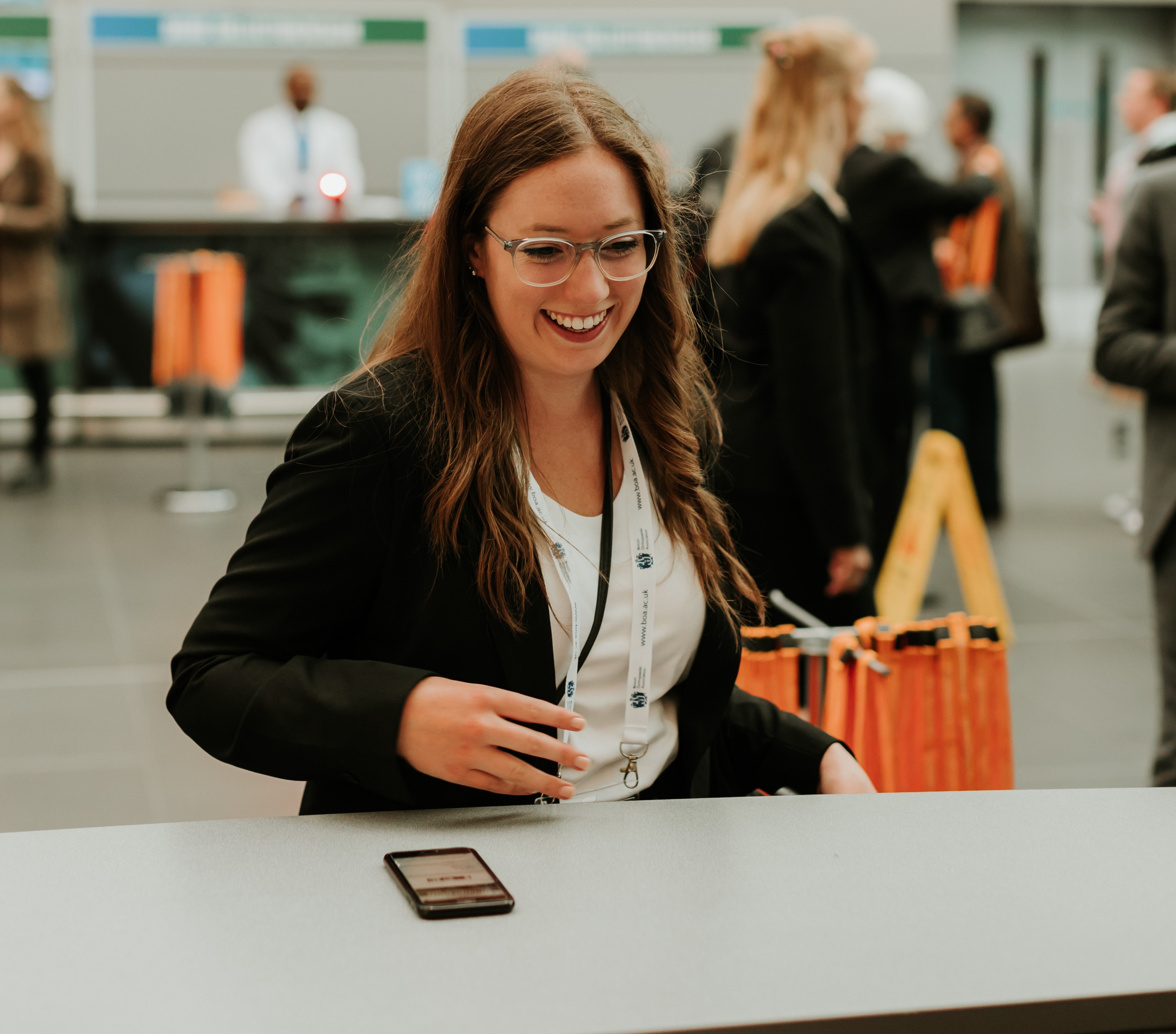 female delegate collecting badge.jpg 1